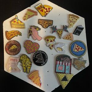 Collection of enamel pizza pins.